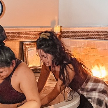 Juliana providing labor support during a water birth