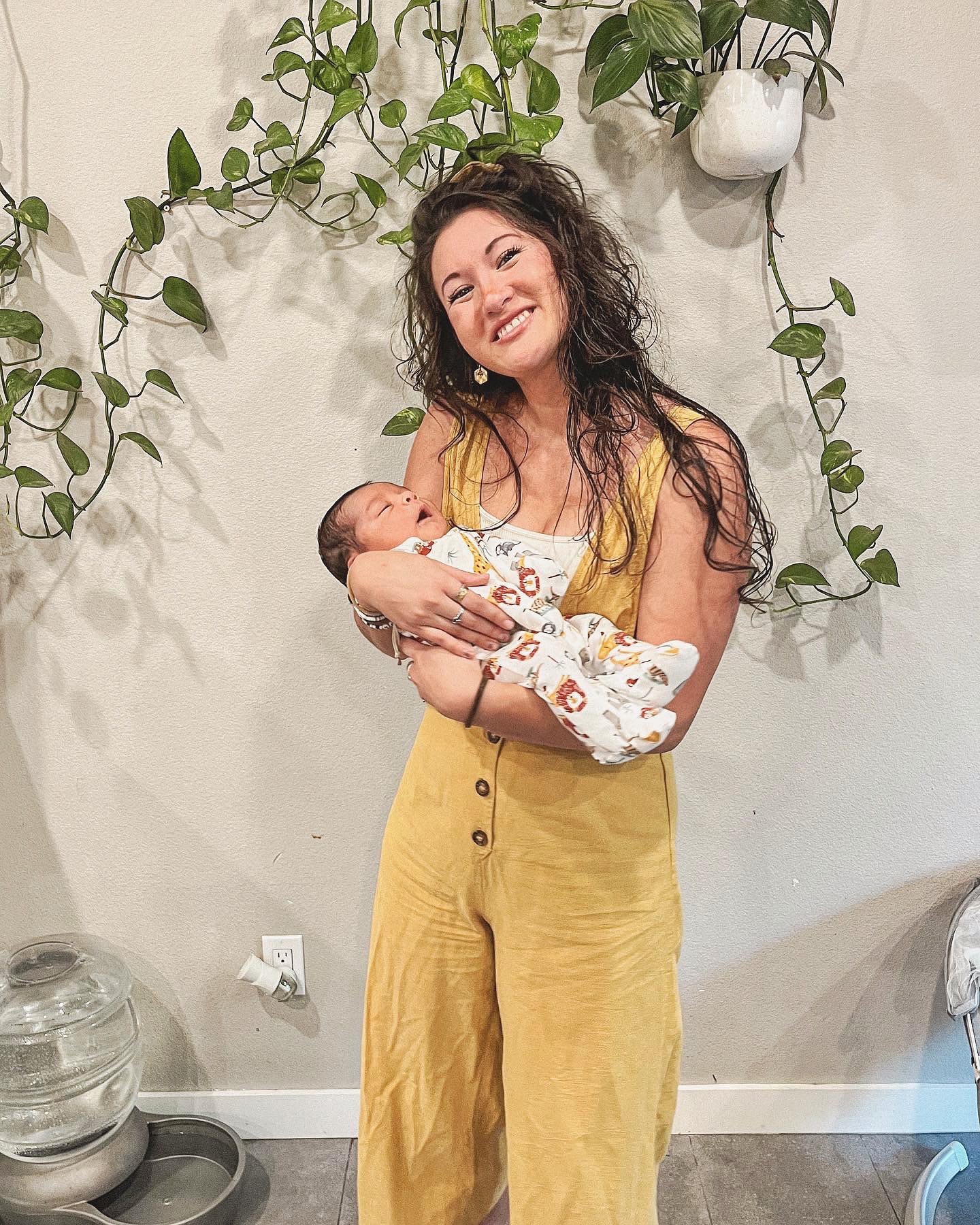 Juliana Lunde, San Diego birth doula, holding a newborn baby